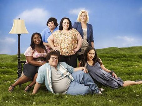 harvey along with other plus size actors on the poster of huge 